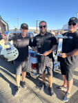 06 Winners posing with a 1973 87 Chevrolet truck and trophy celebrating at the Triple Crown Truck Show