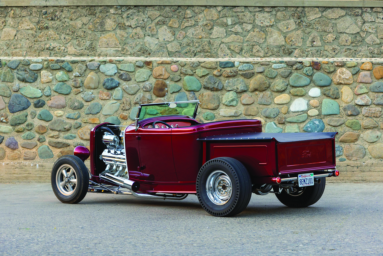 07 Rear view of the 1932 Ford Roadster pickup highlighting its sleek polished tailgate and dual exhaust