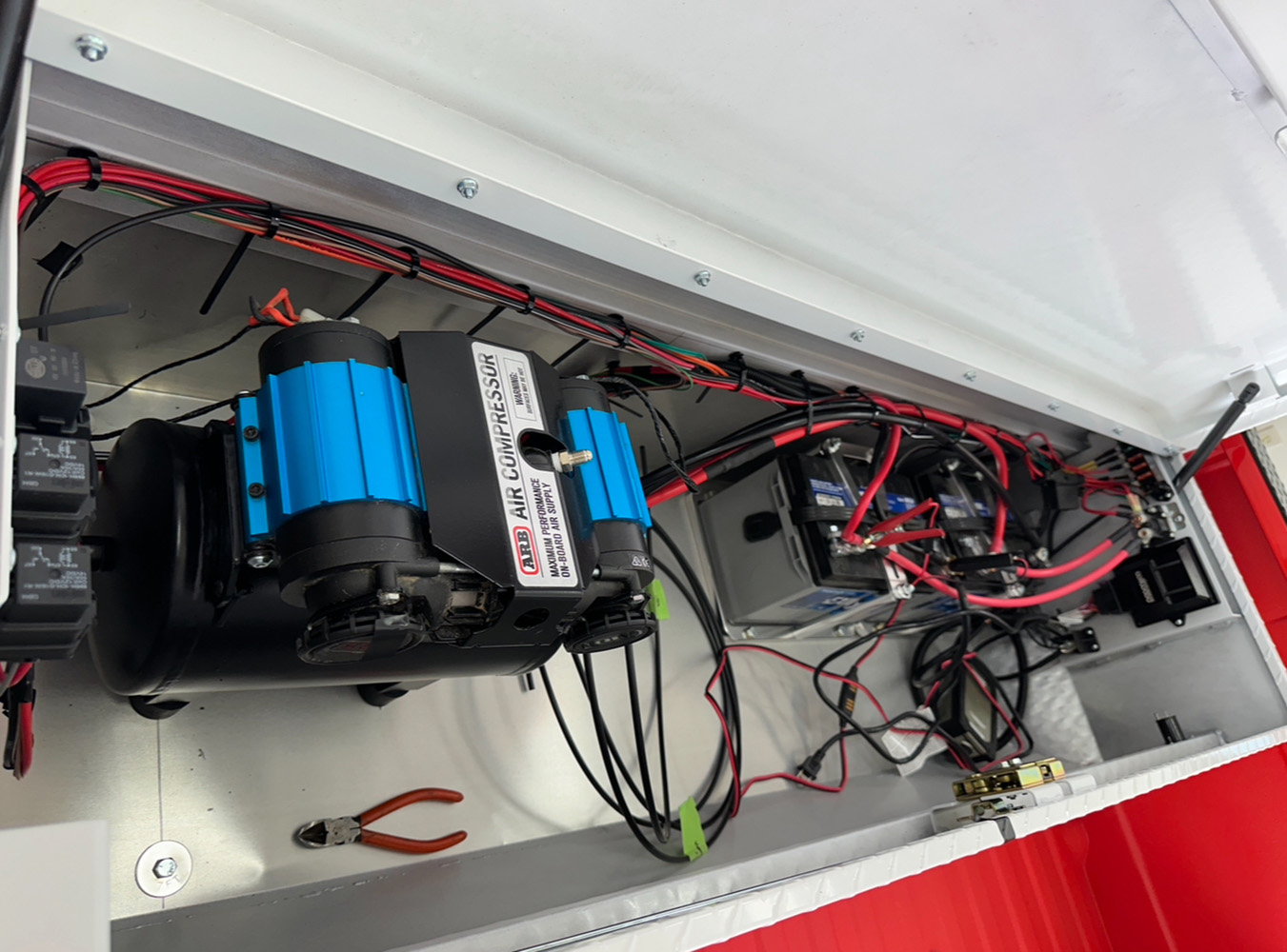 08 ARB air compressor system installed in truck's rear compartment supporting off road utility
