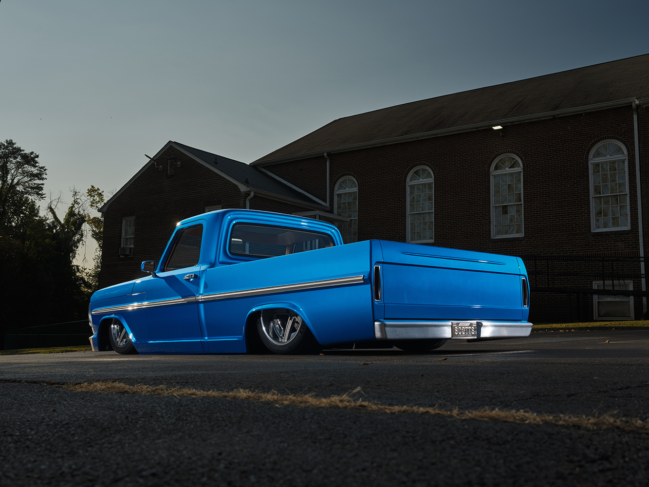 10 1969 Ford F 100 bed interior with blue paint and spare mounted off road wheel ready for rugged use