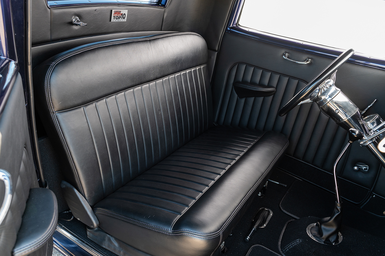 11 1932 Ford Coupe with a custom black leather bench seat and classic hot rod interior styling