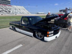 11 Custom 1993 Chevrolet 454 SS pickup with lowered stance and Official Truck Indy 500 graphics displayed at Nashville Superspeedway