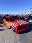 14 Red 1988 98 Chevrolet CK truck with vibrant flame paint job capturing attention at the show