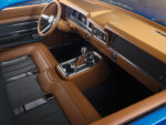15 Interior of 1969 Ford F 100 with tan leather wrapped dashboard and steering wheel showcasing a modern retro design