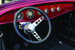 16 1932 Ford Roadster custom dashboard with chrome accented gauges and three spoke steering wheel