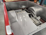 16 Installed metal bed floor showcasing precision grooves and fuel cell setup in Chevy OBS truck