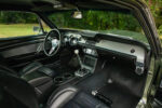 19 1967 Ford Mustang Fastback interior featuring black leather seats classic Hurst shifter and chrome trim accents