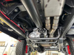 19 Underbody shot of GMC K2500 showing the robust transmission custom driveshafts and exhaust headers