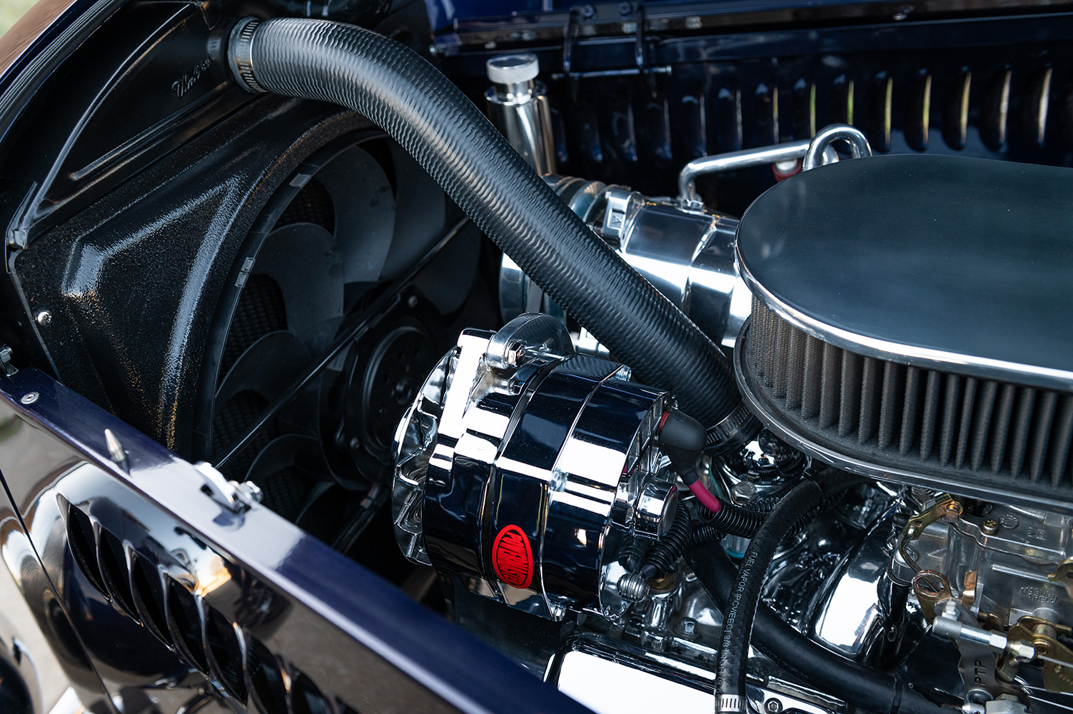 21 Close up of 1932 Ford Coupe's chrome alternator and custom radiator fan