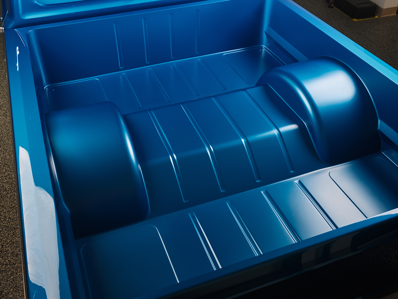 22 Immaculate bed of 1969 Ford F 100 painted in metallic blue with smooth wheel arches and a seamless finish