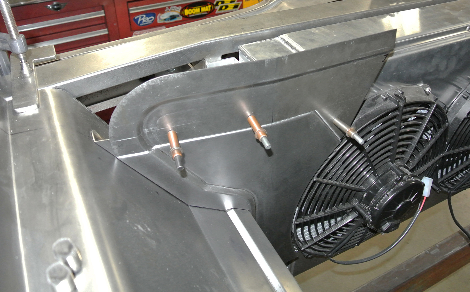 24 Aluminum radiator shroud and dual fan assembly fitted with Cleco fasteners for alignment in the 1959 Chevy