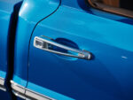 27 Polished chrome door handle on a vibrant blue 1969 Ford F100