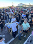 29 Crowd gathers around the judging table eager to see results and awards at the Triple Crown Truck Show