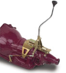 001 1957 Chevy Lokar shifter installed on a classic transmission featuring polished handle and modern functionality