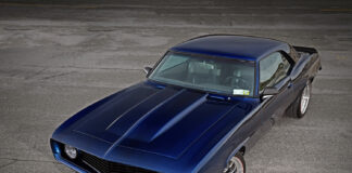 001 1969 Camaro custom pro touring build with deep blue metallic paint split spoke wheels and redline tires