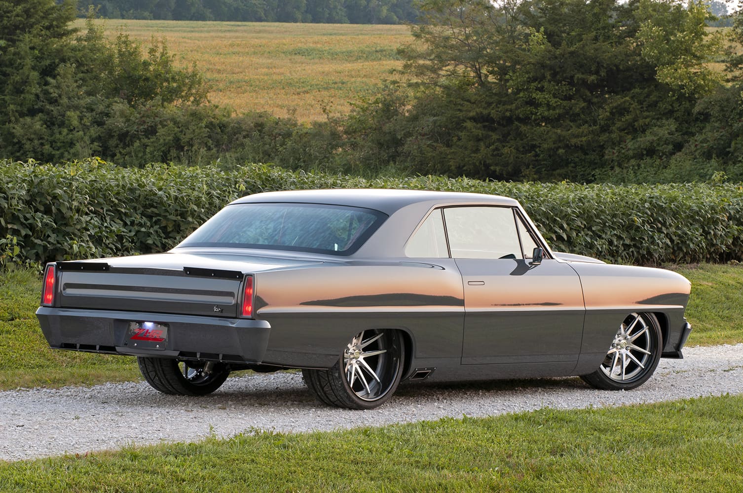 003 1967 Chevy Nova rear showcases smooth bodywork custom taillights and a subtle spoiler for a modern finish