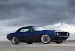 003 1969 Camaro side profile with clean body lines flared fenders and wide custom tires on polished wheels