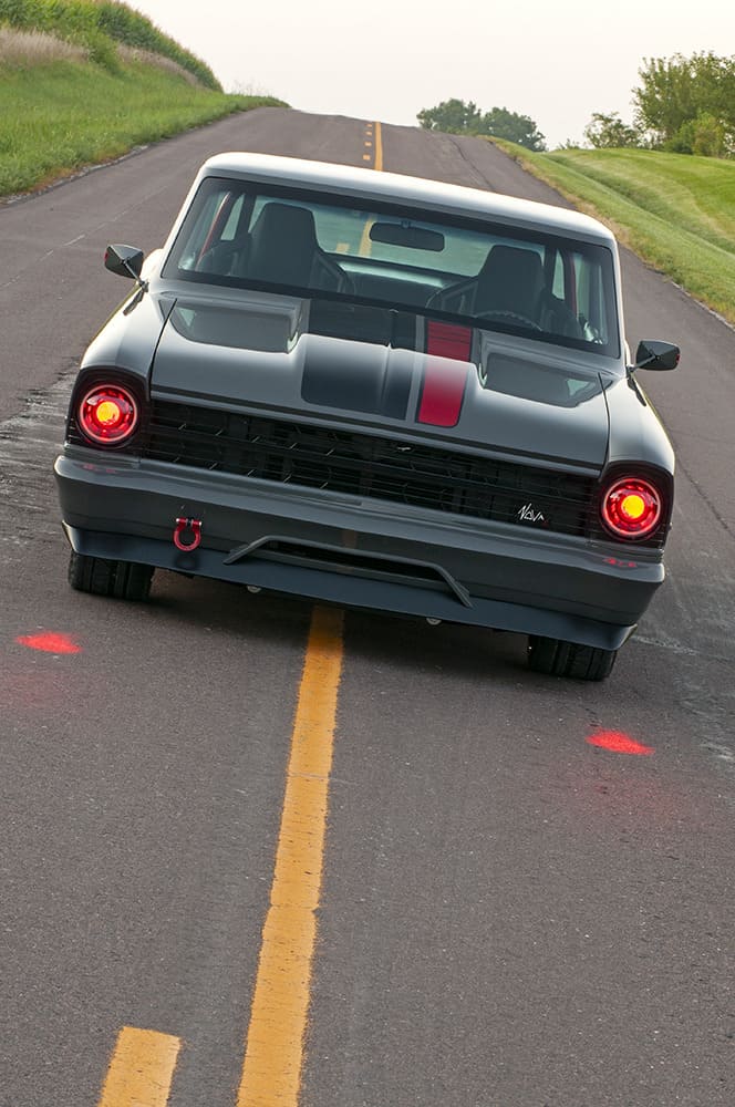 004 1967 Chevrolet Nova side profile highlights a lowered stance large chrome wheels and sleek custom bodylines