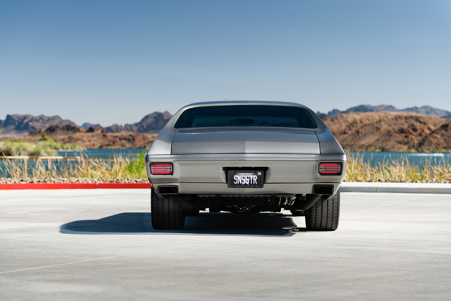 005 1970 Chevy Chevelle rear shot highlighting custom SNSSTR license plate and blacked out taillights
