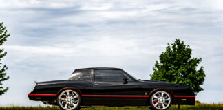 01 1985 Chevy Monte Carlo black coupe side profile chrome wheels red pinstripes classic muscle car design