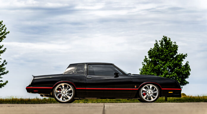 01 1985 Chevy Monte Carlo black coupe side profile chrome wheels red pinstripes classic muscle car design