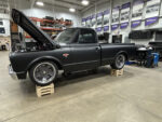 Detroit Speed Engineering Speed Kit and SpeedMax 1967-1987 C10 IFS 01 Chevy C10 truck on wood risers showcasing a matte black finish and open hood for customization