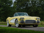 01 Yellow 1961 Corvette rear three quarter view tailfins round taillights chrome details