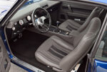 014 1969 Chevrolet Camaro pro touring interior with custom leather bucket seats modern console and performance focused gauges