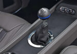 015 1969 Chevrolet Camaro carbon fiber shifter knob on a six speed manual transmission for precise shifting and modern aesthetics