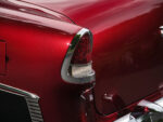 016 1955 Chevrolet Bel Air rear tailfin and red metallic paint showcasing classic Chevy styling and chrome trim details