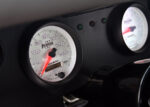 016 1969 Chevrolet Camaro dashboard with AutoMeter Phantom gauges displaying speed and RPM for a clean retro modern look