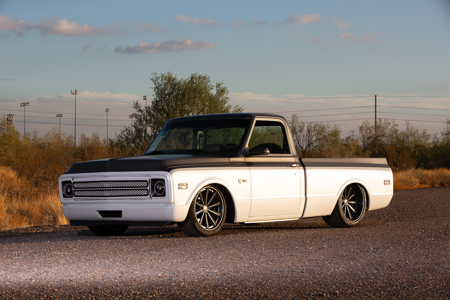 02 Side profile of a 1969 Chevrolet C10 showcasing lowered suspension and matte black trim details