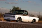 03 Front view of 1969 Chevrolet C10 featuring custom mesh grille and blacked out hood