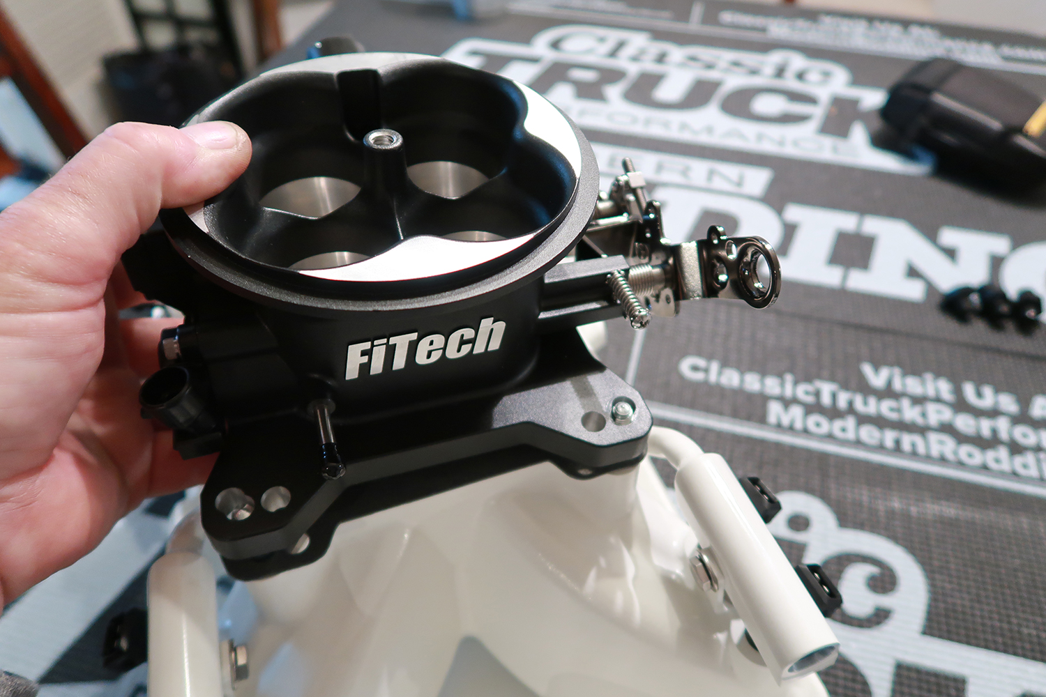 05 FiTech four barrel throttle body mounted on the intake manifold for precise electronic fuel injection control
