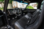 06 1969 Chevy C10 interior with black bench seats retro steering wheel and modern gauges