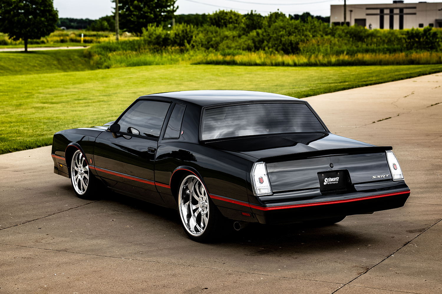 07 1985 Chevy Monte Carlo rear view black paint red pinstripe chrome wheels custom SSRT badge