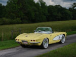 07 Yellow 1961 Corvette stormy sky sleek vintage design chrome highlights