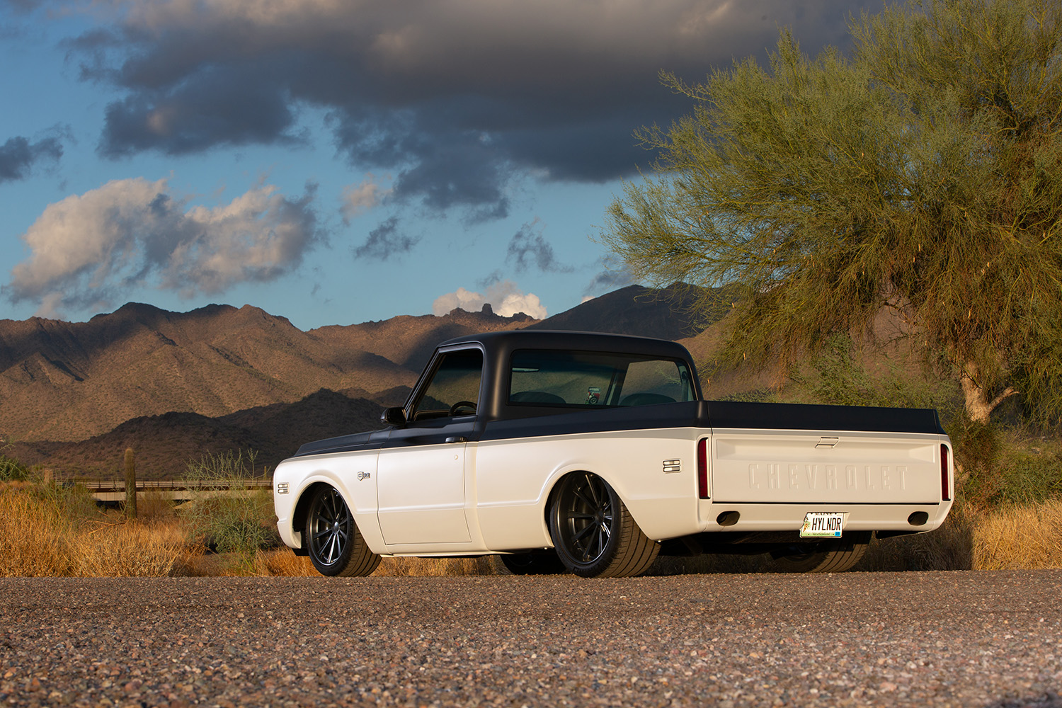 08 Rear quarter angle of 1969 Chevrolet C10 showcasing dual exhausts and custom tailgate lettering