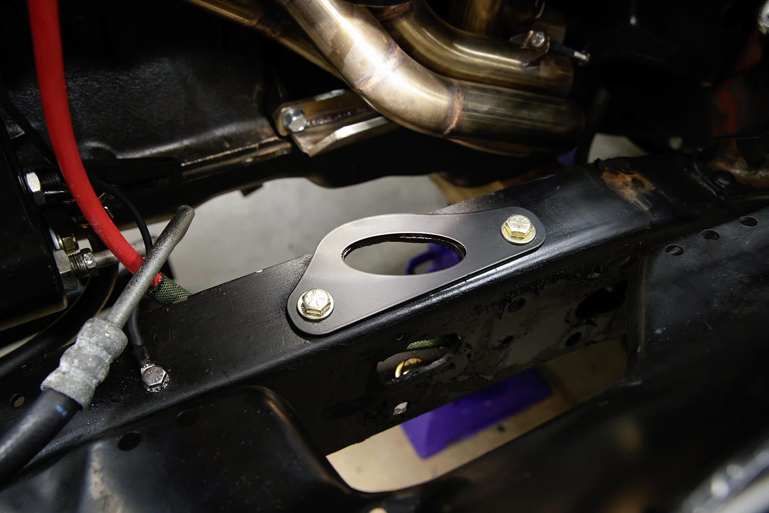 10 Mounted IFS crossmember plate on the Chevy C10 frame secured with grade 8 bolts for stability