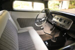13 1932 Ford Coupe interior with white and black houndstooth bench seat and matching door panel upholstery