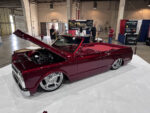 14 Burgundy custom Chevy C10 convertible with chrome wheels and red interior displayed with hood open