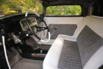 16 1932 Ford Coupe stylish cabin with houndstooth upholstery vintage style controls and clean minimalist design