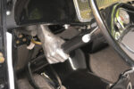 17 1932 Ford hot rod custom steering column with sculpted hand shaped mount and black and white steering wheel