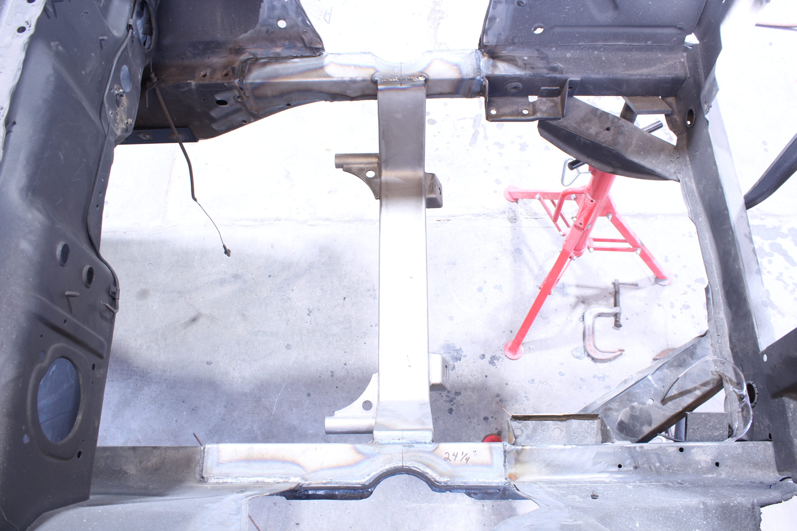 17 Top view of a custom crossmember installed for added structural integrity on a 1965 Mustang chassis