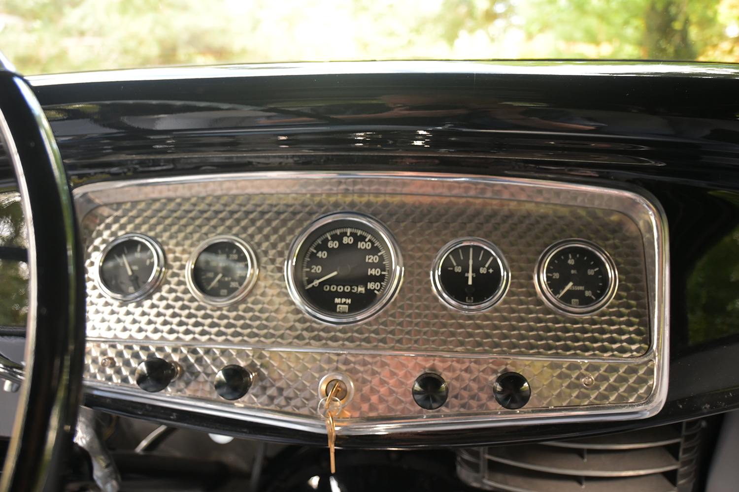 18 1932 Ford Coupe dashboard showing detailed classic gauge cluster with speedometer oil pressure and temperature readings