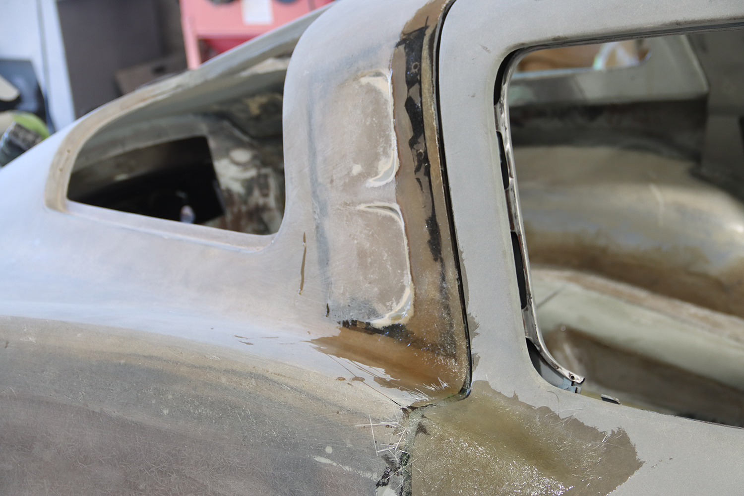 18 Close up of C2 Corvette s B pillar repair with detailed fiberglass reinforcement and shaping work