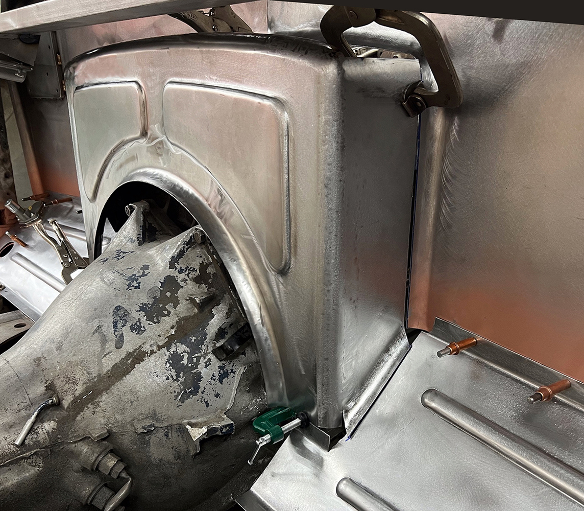 18 Close up view of fabricated firewall arch with detailed contours custom vintage car fabrication