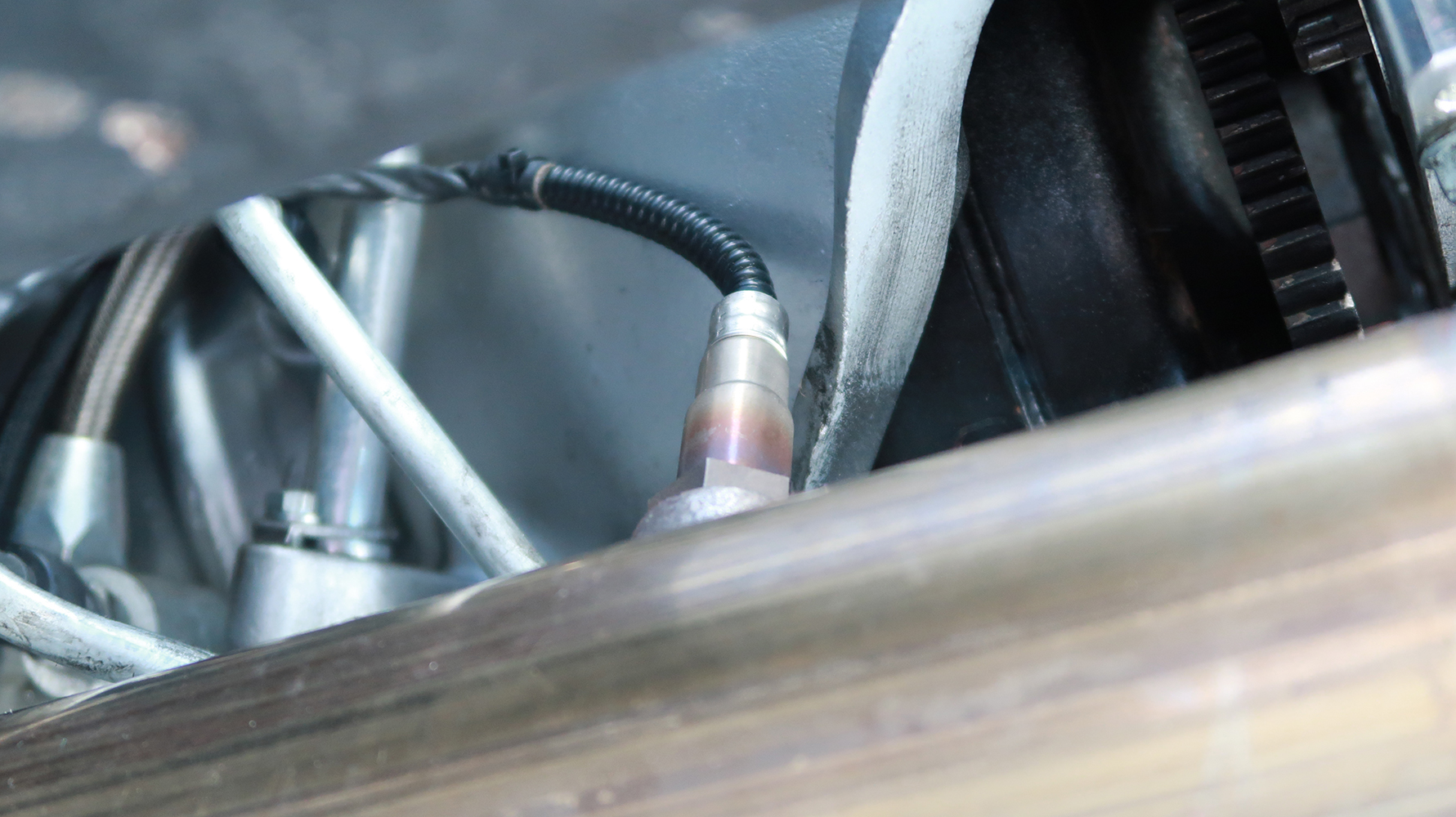 18 Coolant temperature sensor installed on the intake manifold to relay engine temperature data to the EFI system