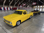 18 Yellow Chevy C10 truck with chrome wheels displayed with a matching custom boat on a trailer