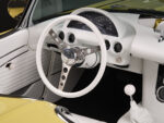 22 Steering wheel close up 1961 Corvette white leather chrome accents classic design